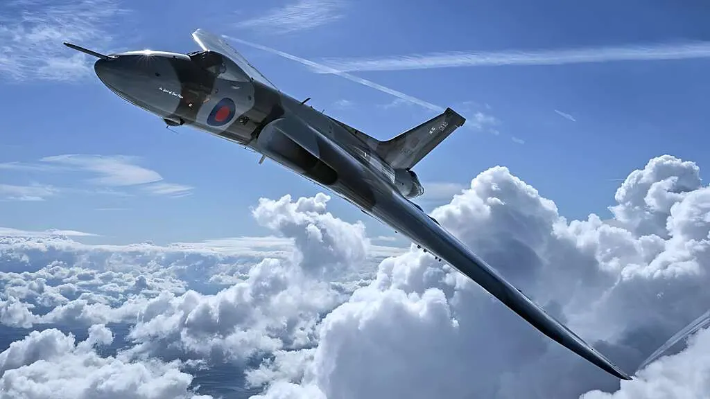 Military aircraft in flight above white clouds against a blue sky.