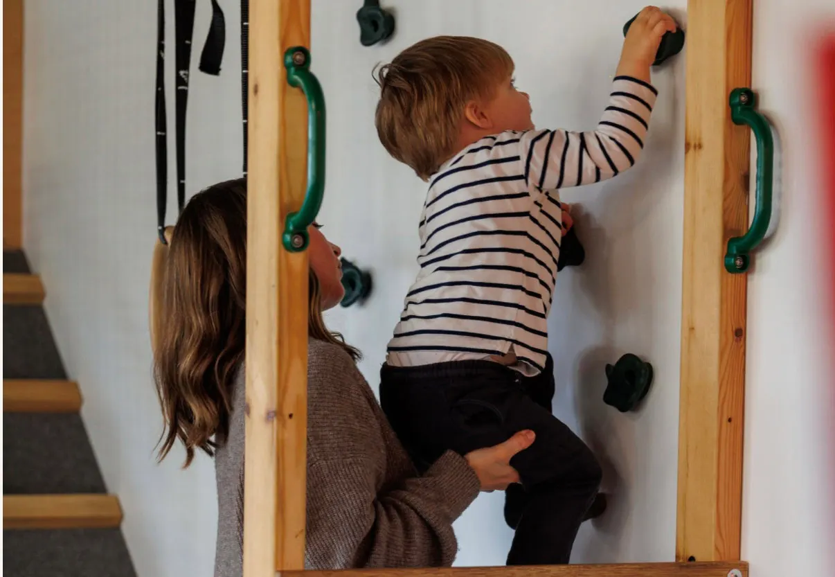Soft-play slide and climbing wall at The Hub