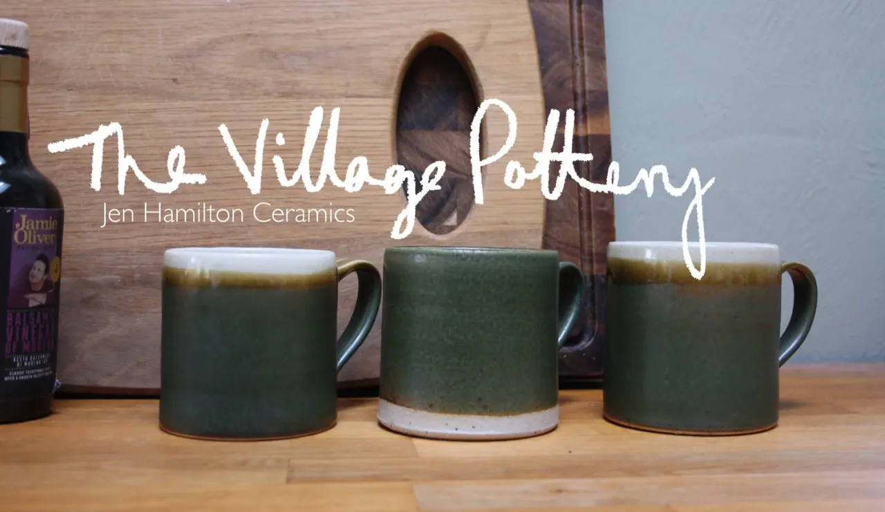 This is a designed graphic. The image shows overlaid text ("The Village Pottery" and "Jen Hamilton Ceramics") on a photograph of ceramic mugs and pottery items.

GRAPHIC