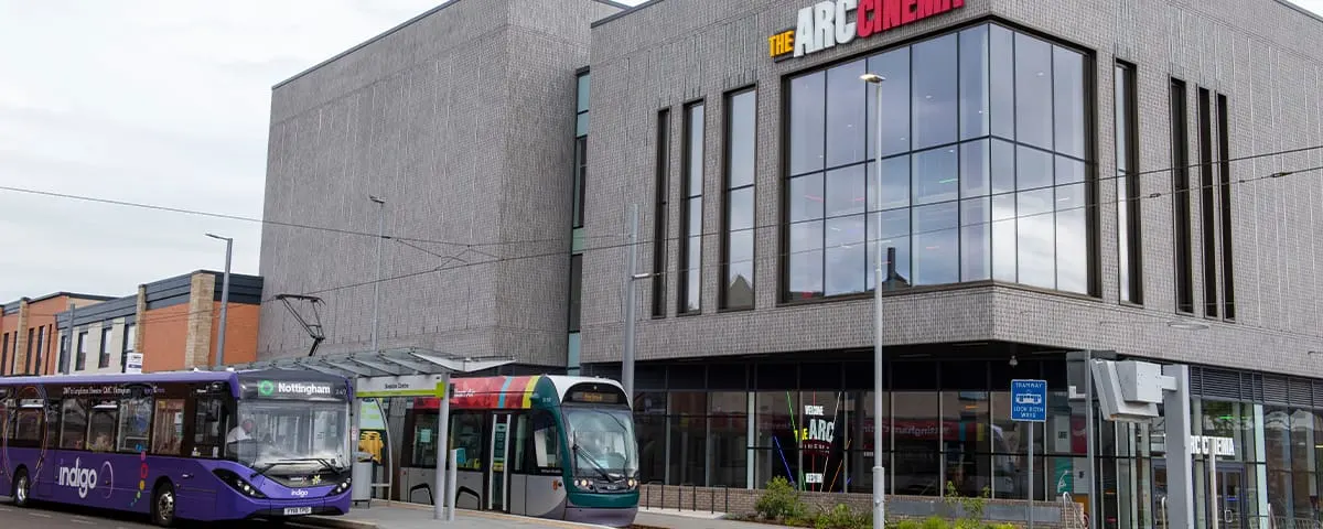 The Arc Cinema Beeston exterior on Station Road with tram and bus