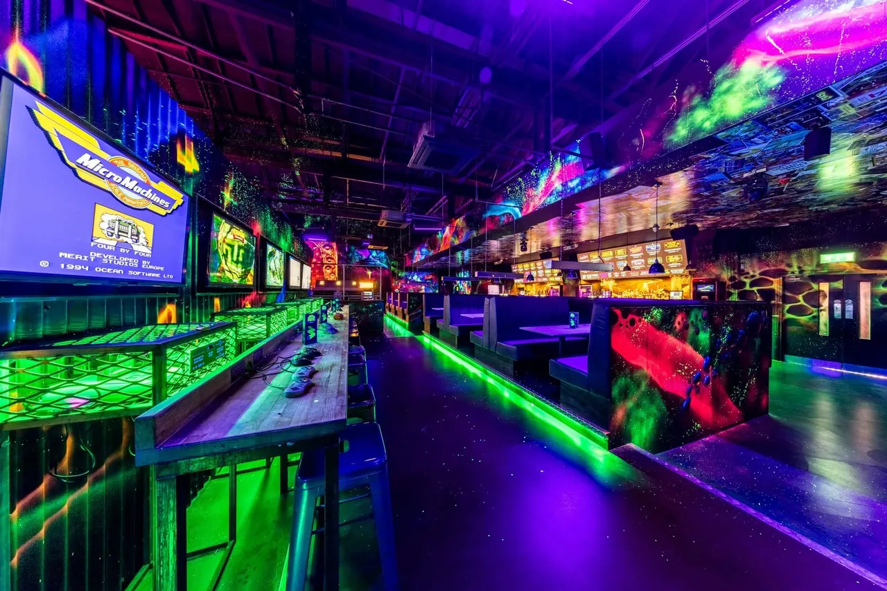 NQ64 Nottingham neon arcade floor with cabinets