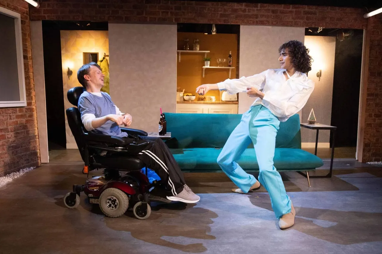 Two people enjoying a scene in a modern apartment set, one in a powered wheelchair and one dancing on a turquoise sofa.
