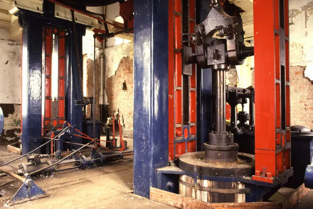 The restored red and blue vertical winding engine inside Bestwood Winding Engine House
