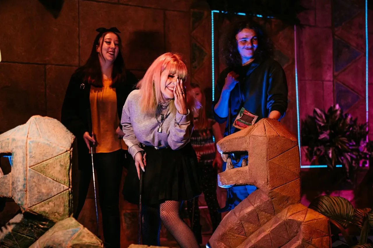 Group on indoor jungle mini golf course at Treetop Golf
