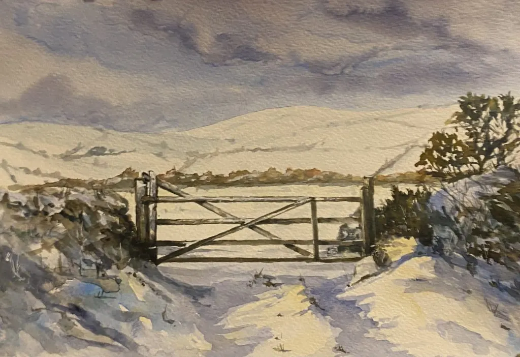 Watercolour painting of a wooden farm gate in snowy landscape with hedgerows and distant hills.