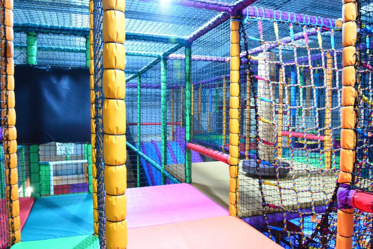 Three-storey soft play frame and big slide at Squiggles Playden