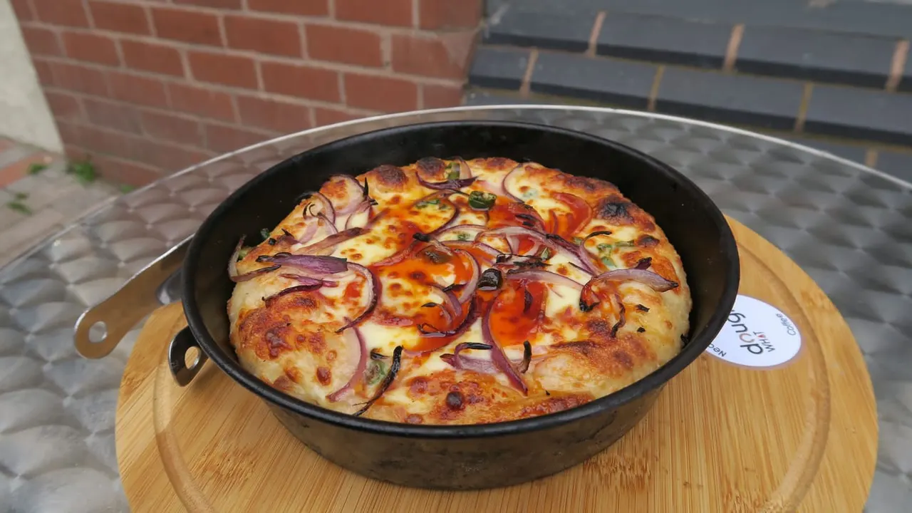Pizza and table at Dough What Leicester