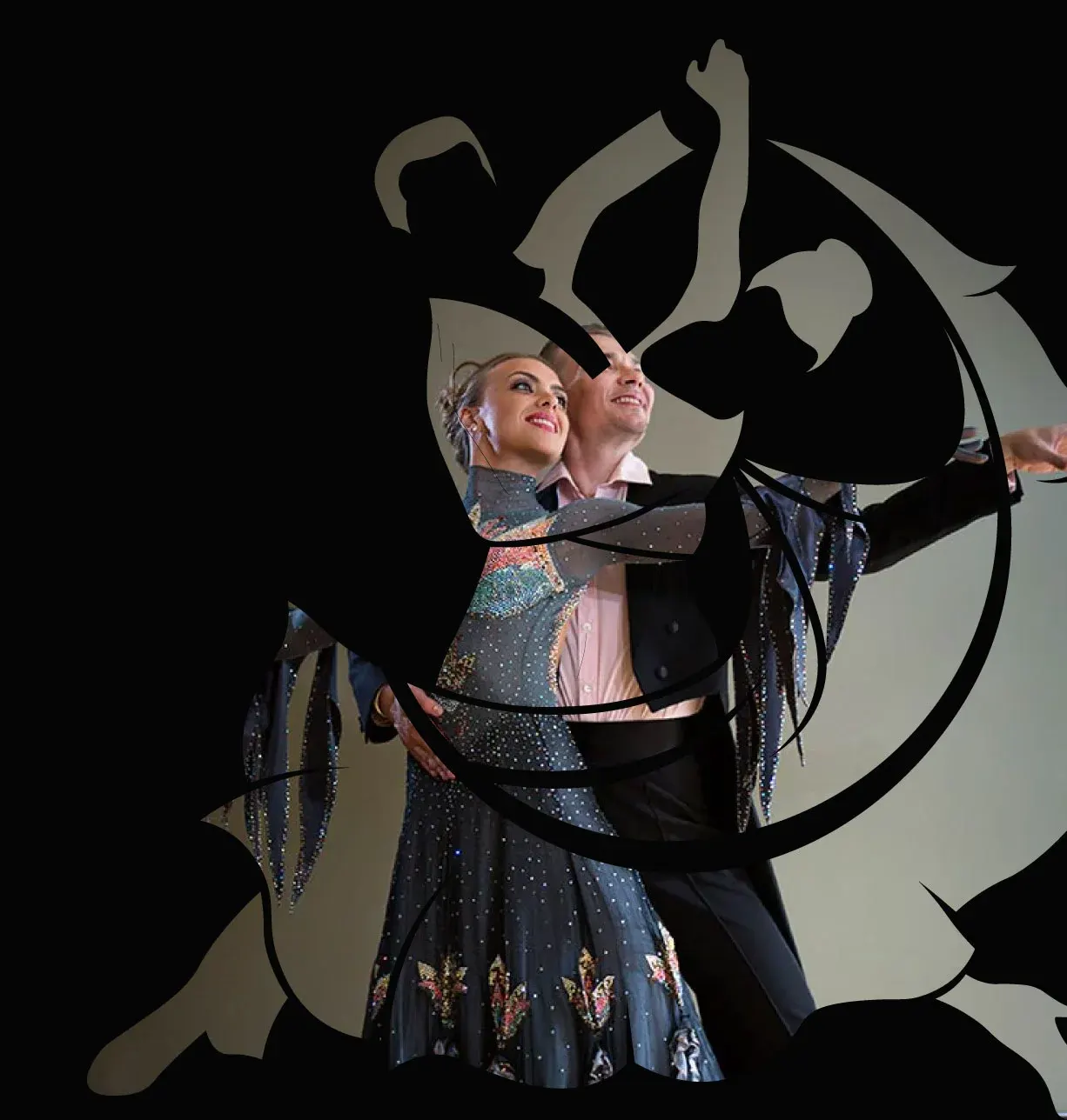 Two dancers in sequined ballroom costumes perform with flowing fabric props against a black background.
