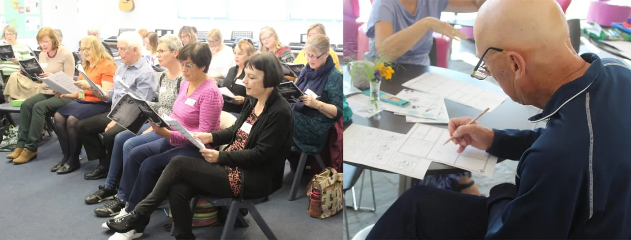 A group of adults sitting in a circle during a community arts workshop, with an instructor demonstrating on the right.