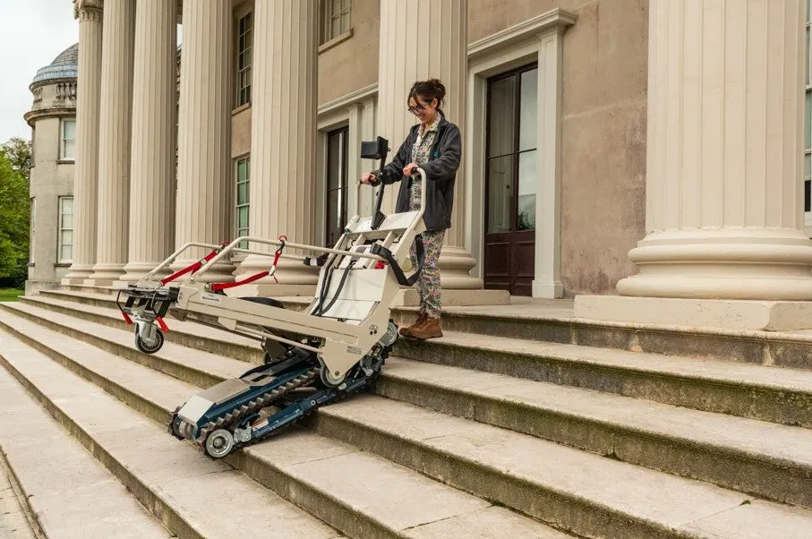 Person demonstrating motorised climbing devices on the grand stone steps of a neoclassical mansion with tall columns.