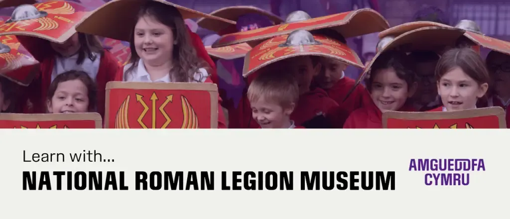 Children in Roman Legion costume and shields at an interactive museum display.