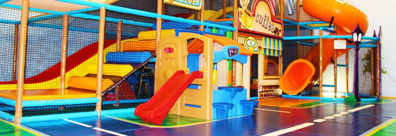Wide view of soft play structures and play frames inside Jangos Indoor Play Centre
