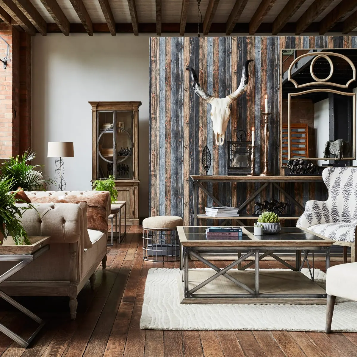 This is a PHOTOGRAPH, so here is the alt text:

Rustic lounge interior with upholstered furniture, wooden beams, and animal skull mounted on weathered wood wall.