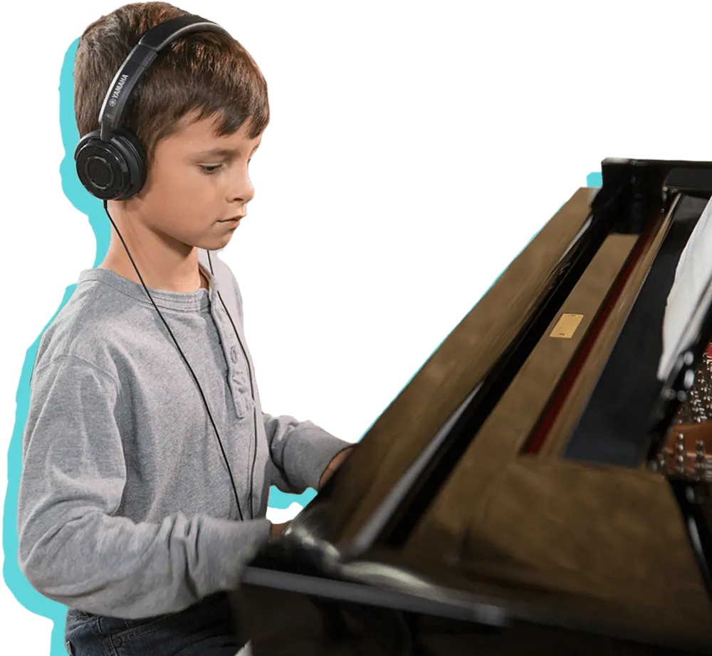Child wearing headphones playing a keyboard instrument against a white background.