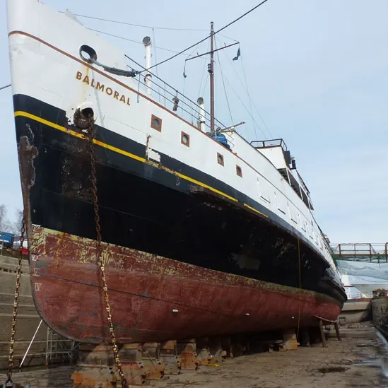 Vintage passenger ship Balmoral moored in dry dock for maintenance and restoration work.