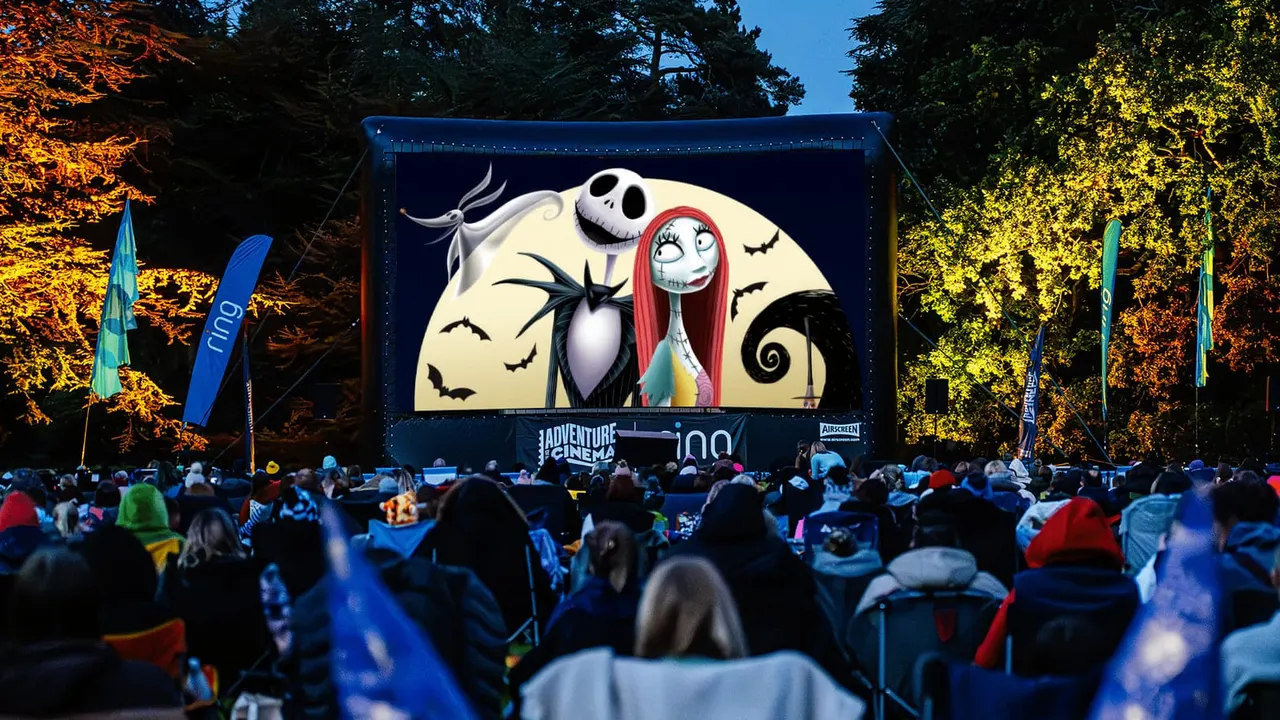 Outdoor cinema screen showing Nightmare Before Christmas cover art