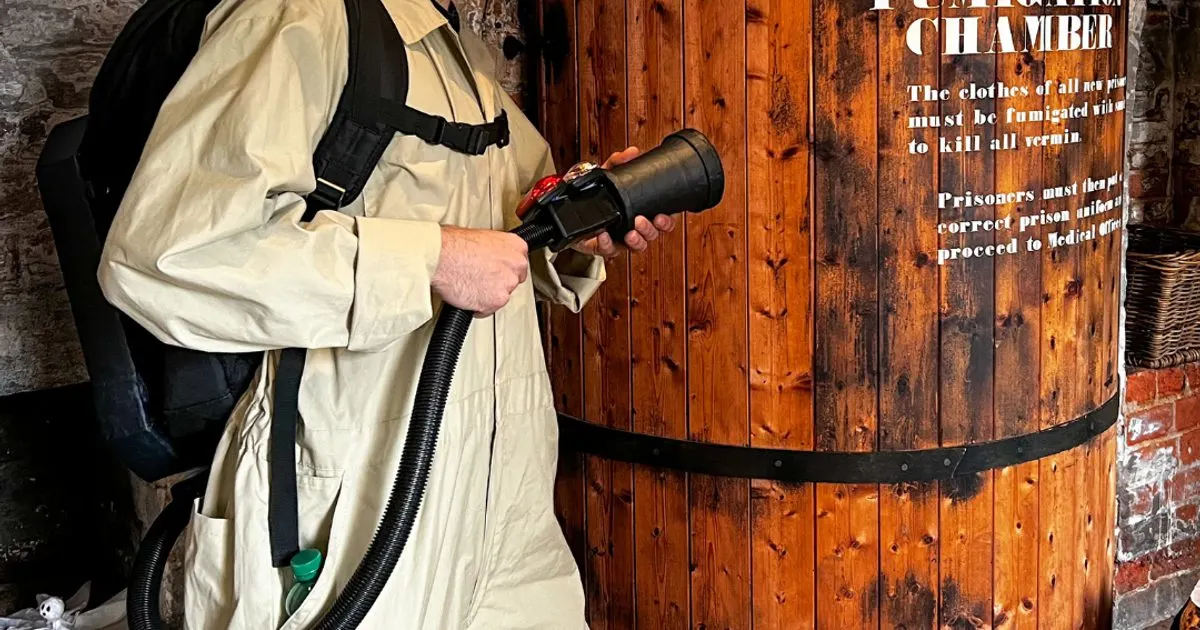 Ghost Hunter character in gaol with proton-pack kit
