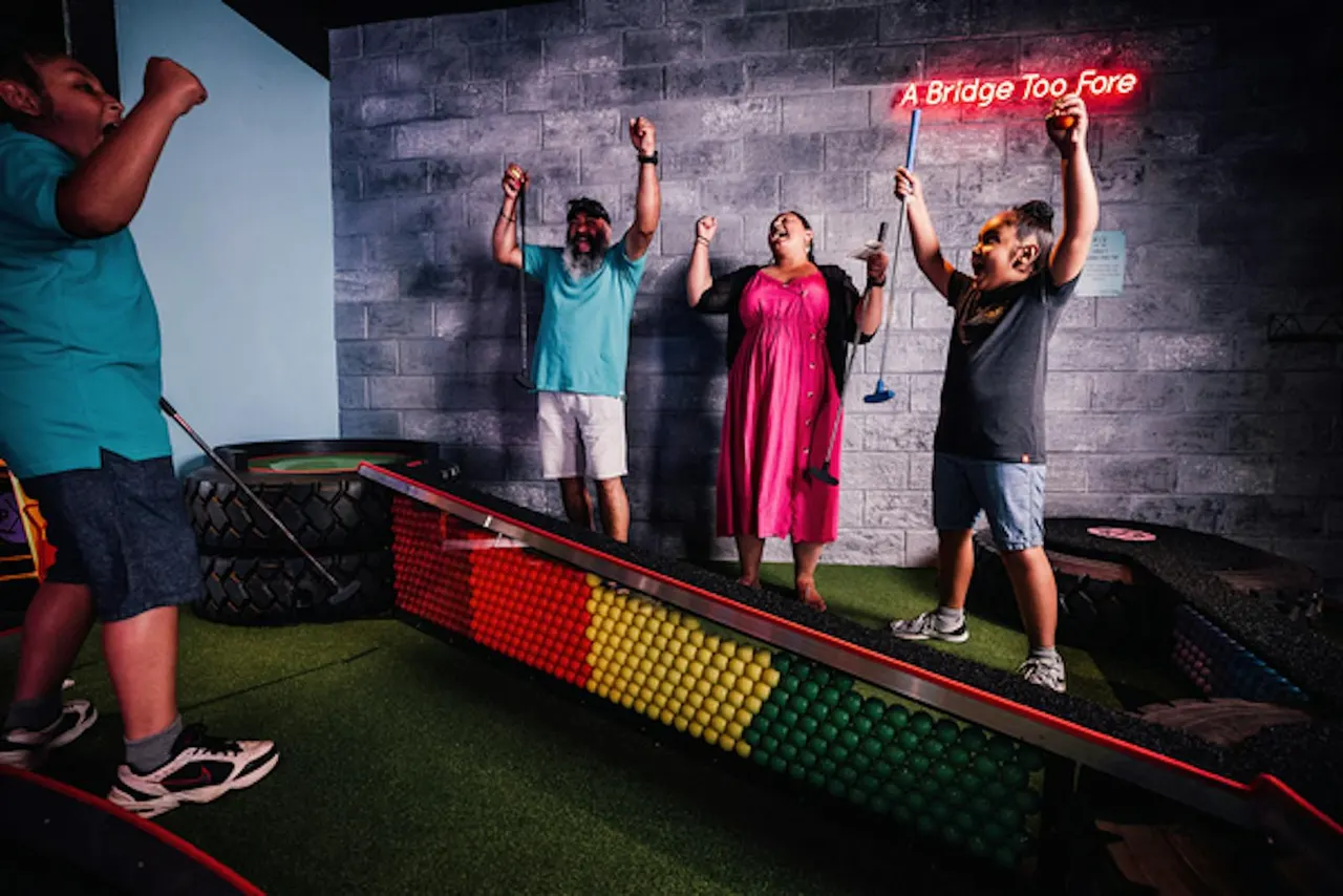 Family crazy golf session at Putt Club
