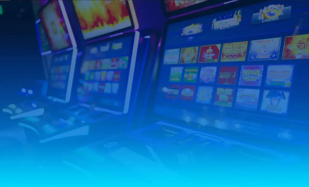 Slot machines with colourful game screens illuminated in blue lighting inside a gaming arcade.