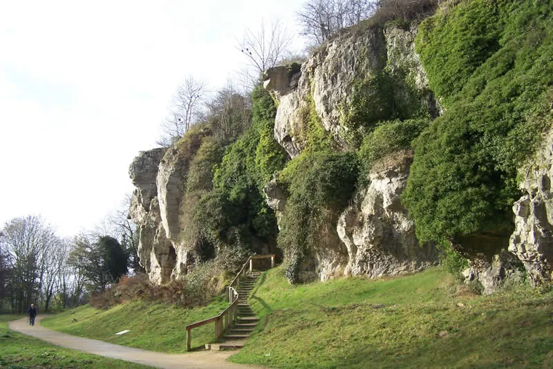 Pin Hole cave entrance in the limestone cliffs at Creswell Crags