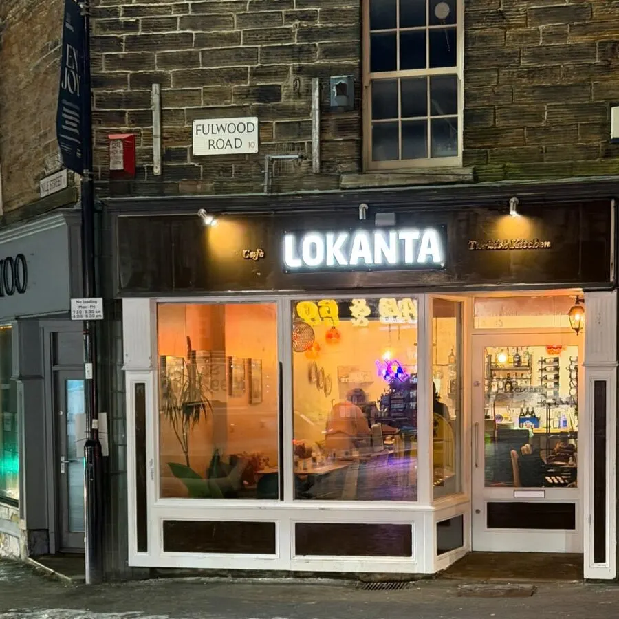 Evening street view of Lokanta Turkish café and restaurant storefront with illuminated signage on Fulwood Road.