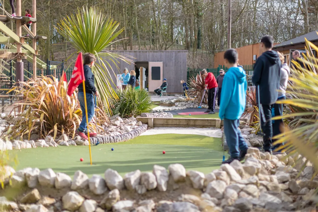 Kids putting on OAZ mini golf greens under Sky Trail at Holme Pierrepont