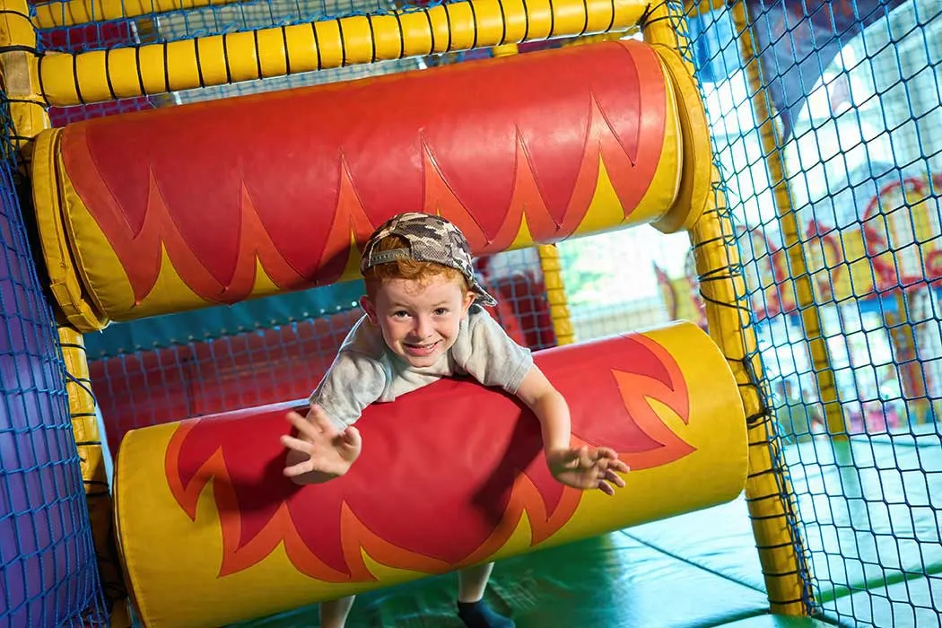 Boy on rollers in the main play frame at 360 Play
