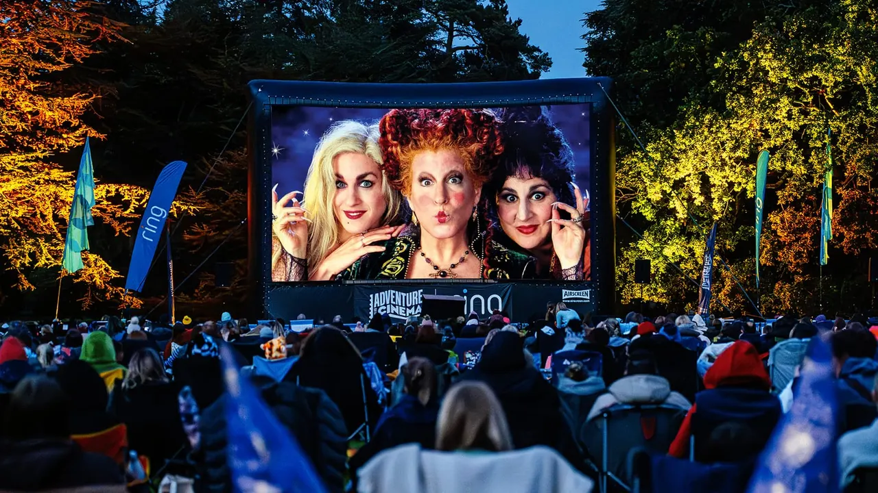 Outdoor cinema screen showing Hocus Pocus Halloween cover art