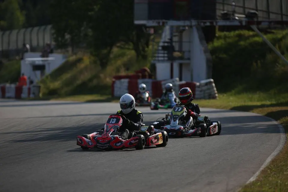 Go-karts racing side by side on Lockwell Hill outdoor asphalt track