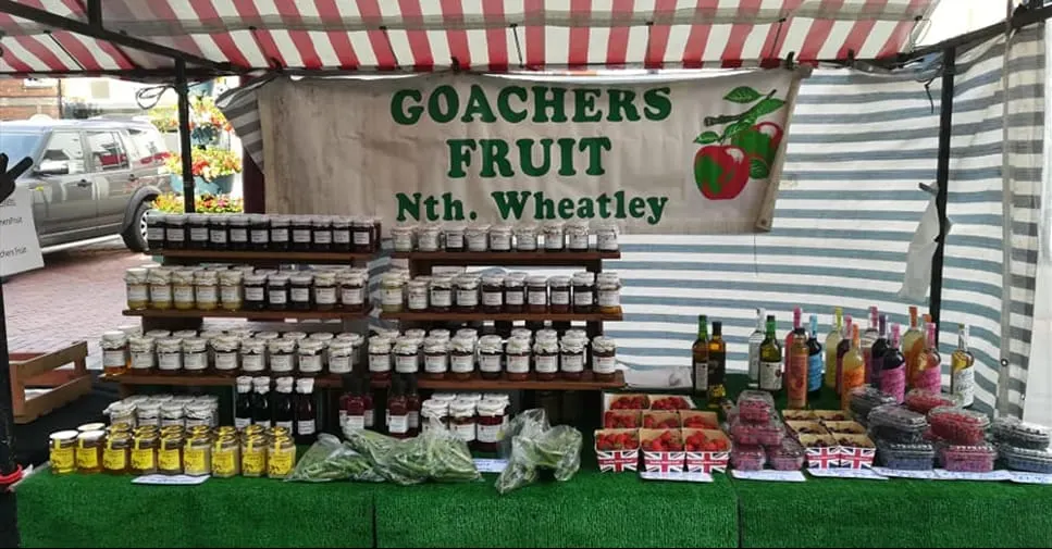 Goacher's market stall under a striped awning