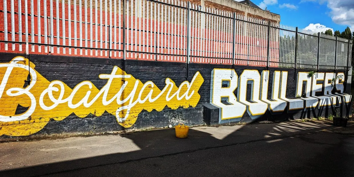 Outdoor ultra-realistic bouldering park walls at Boatyard Boulders by the Meadow Lane arches.
