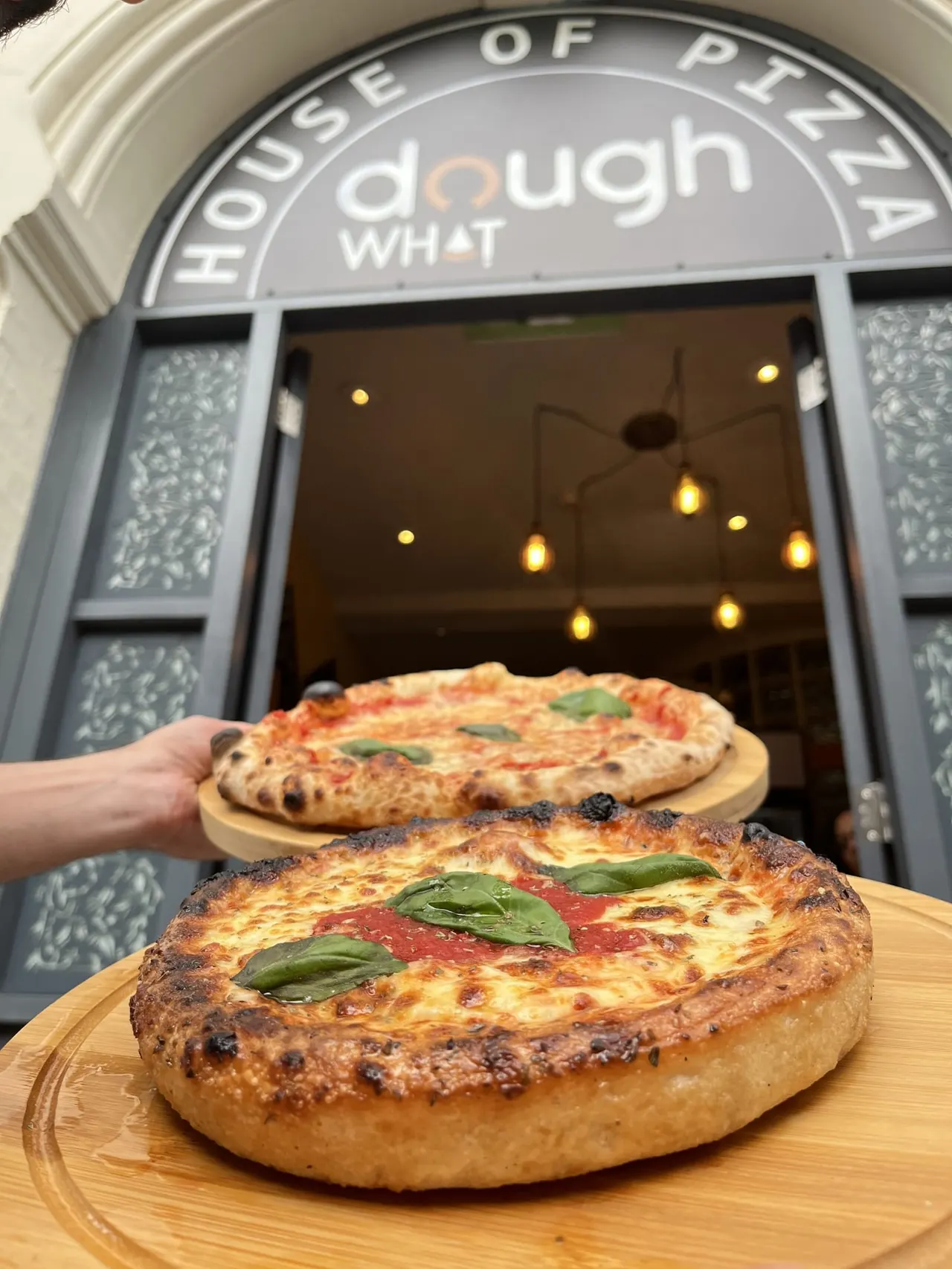Fresh pizza plated at Dough What