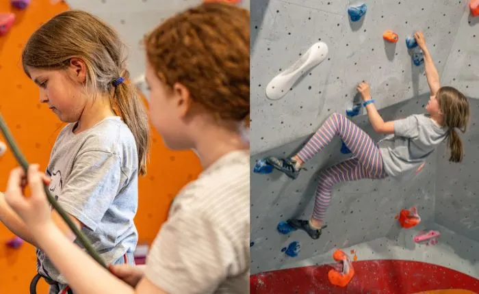 Two children indoor rock climbing on coloured hold walls at an adventure venue.