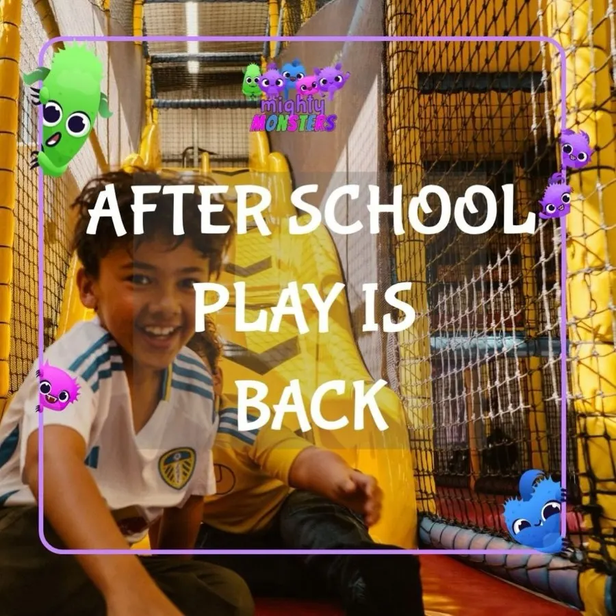 Boy smiling at the base of a yellow soft-play slide with After School Play promo overlay