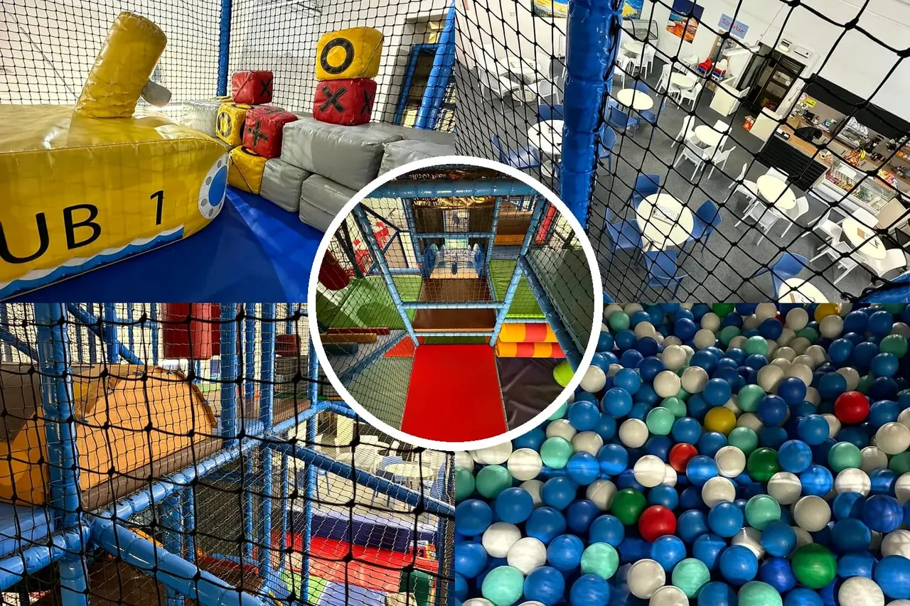 Indoor soft play area with inflatable obstacles, ball pit, and netting in a children's activity centre.