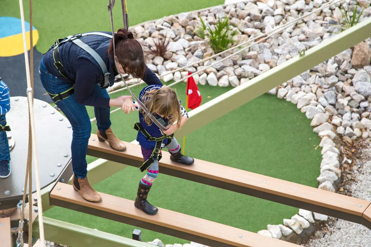 Instructor assisting participant on Sky Trail