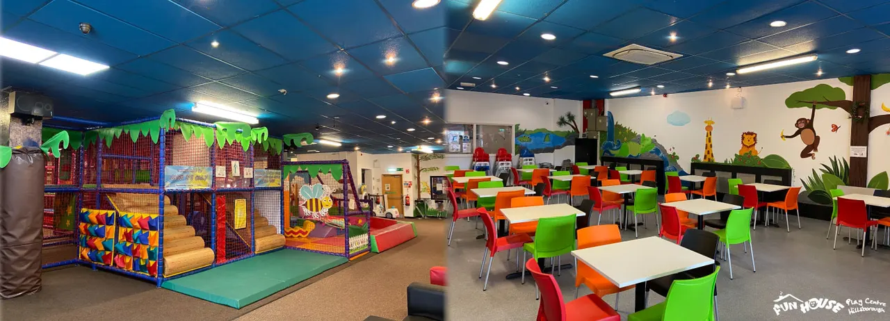 Indoor play centre with soft play structure on left, dining tables with colourful chairs on right, and jungle-themed wall murals throughout.