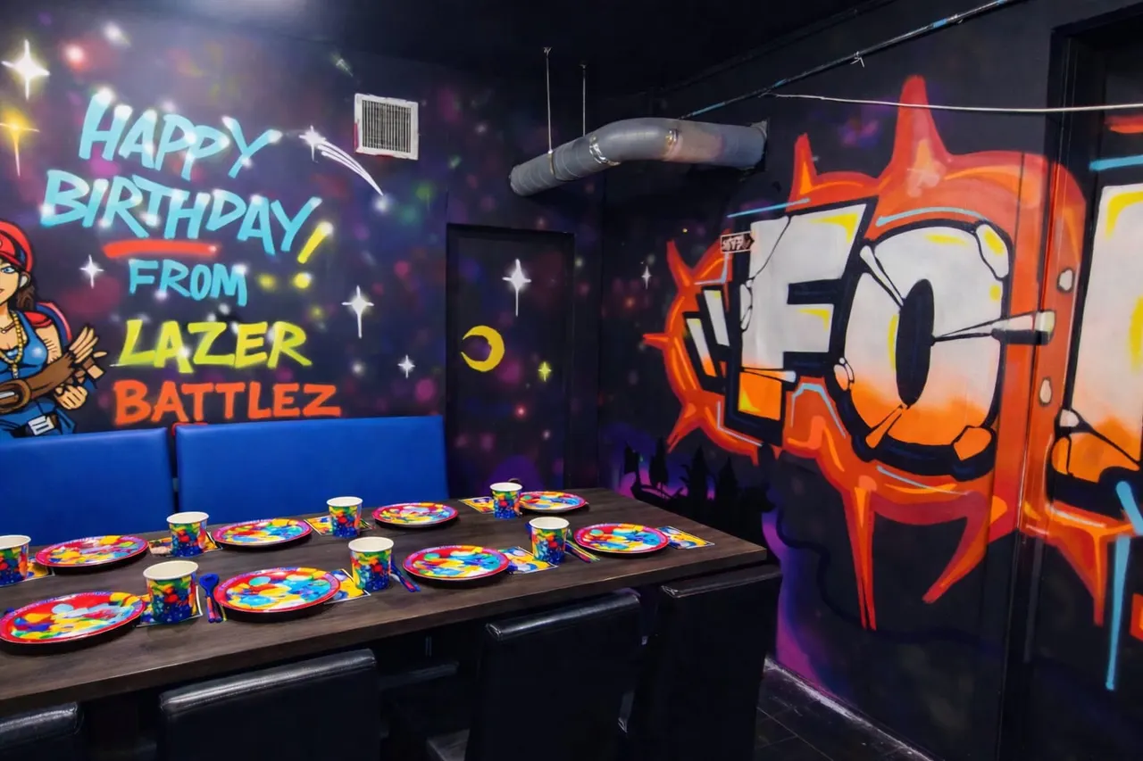 Birthday party table set with colourful plates and cups, neon-lit gaming arena with "Happy Birthday from Lazer Battlez" signage.