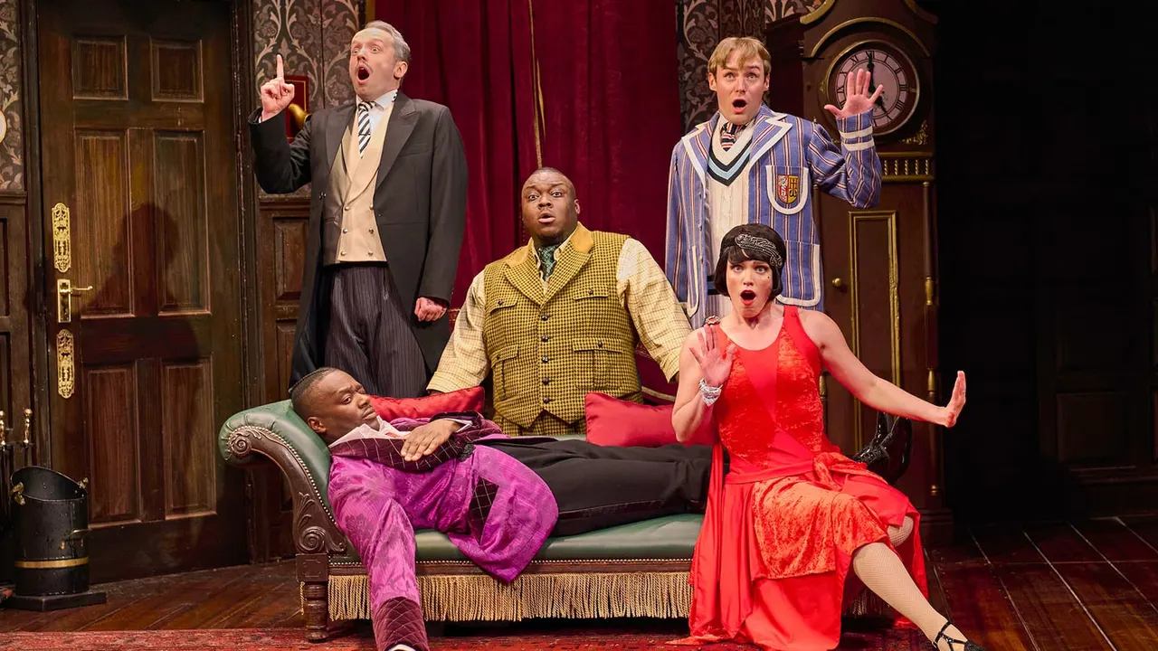 Five actors performing a comedic scene in an ornate drawing room set, with exaggerated expressions and period costumes.