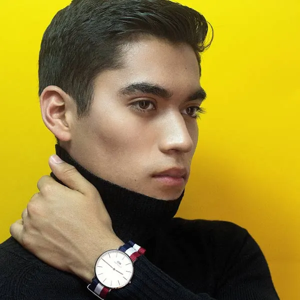 This is a designed graphic — a promotional image with a person posing against a yellow background, styled as a product or lifestyle advertisement rather than an actual venue photograph.

GRAPHIC