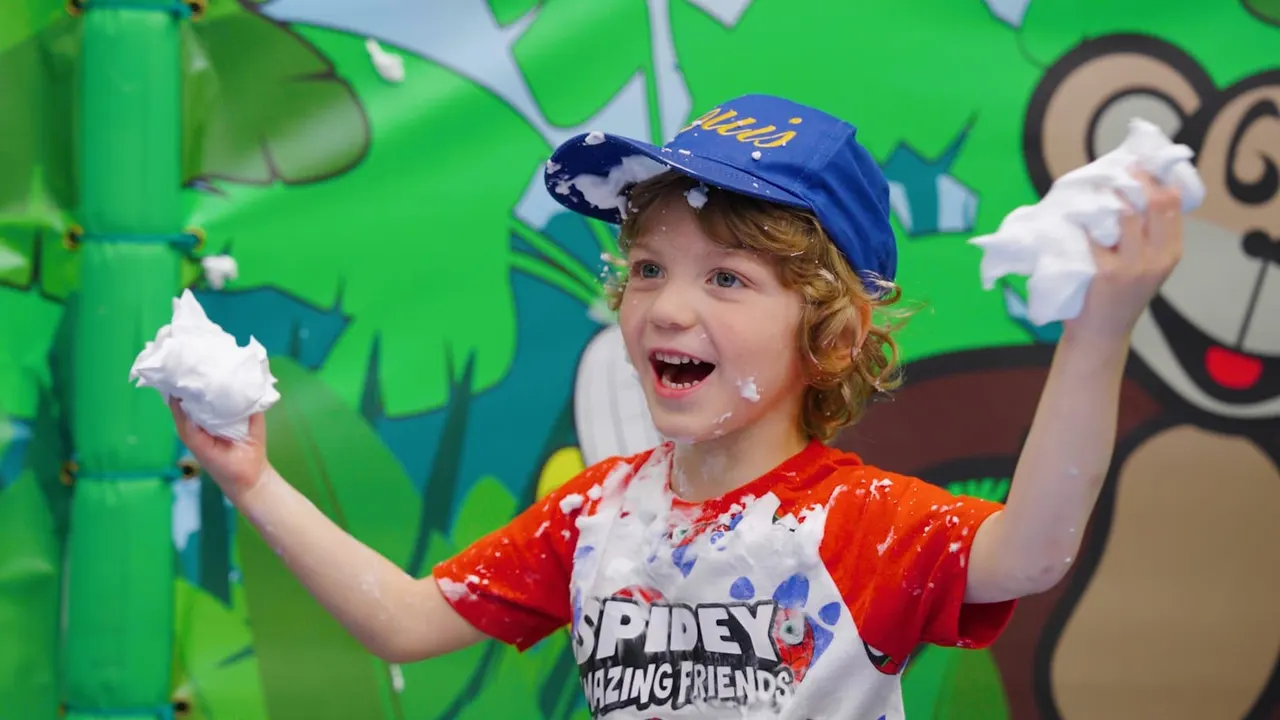 Kids climbing colourful soft play frames at Monkey Bizness