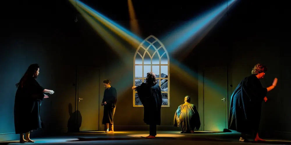 This is a designed graphic — a theatrical promotional image showing a stage scene.

GRAPHIC