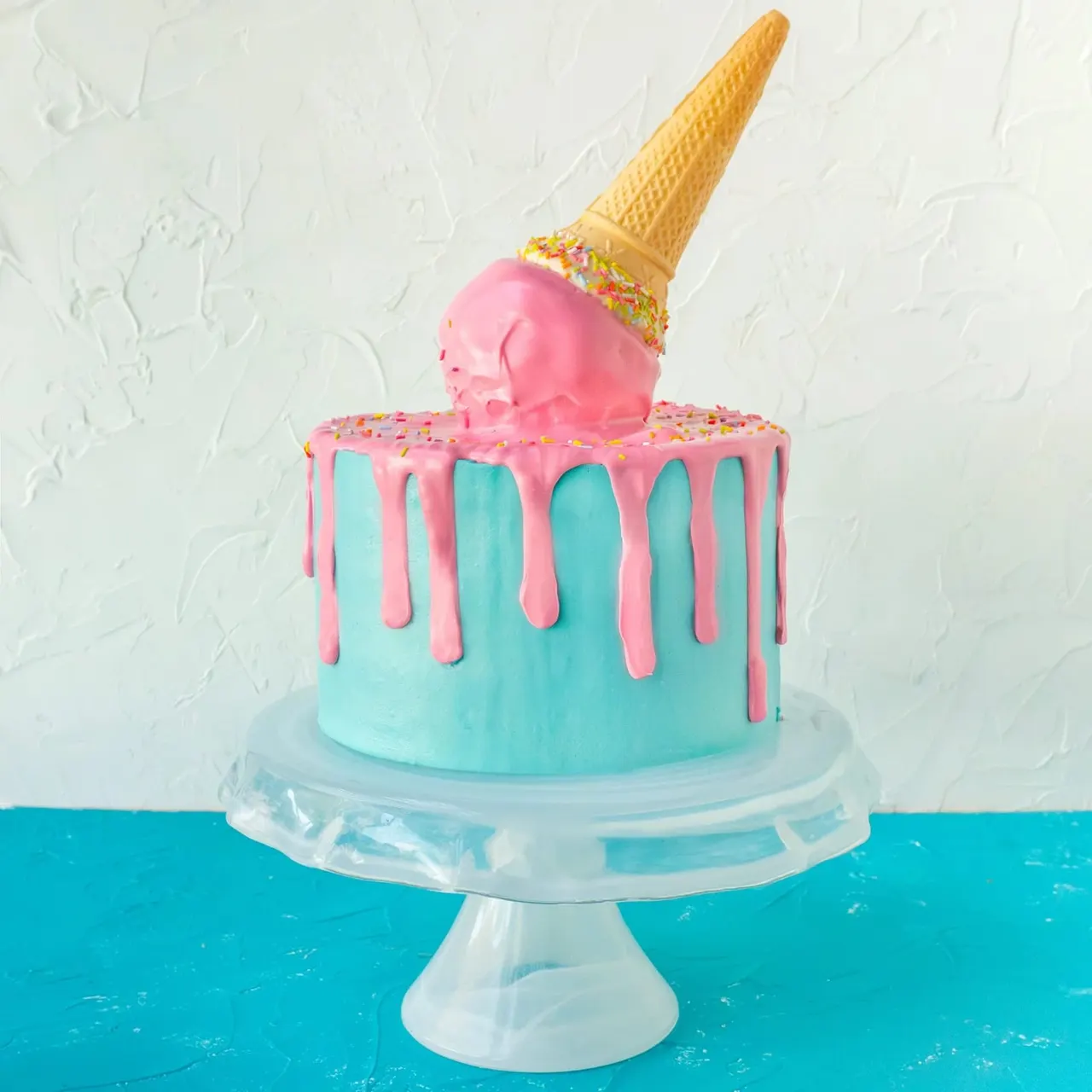 This is a designed graphic, not a photograph. It's a product image of a decorative cake with styled elements.

GRAPHIC