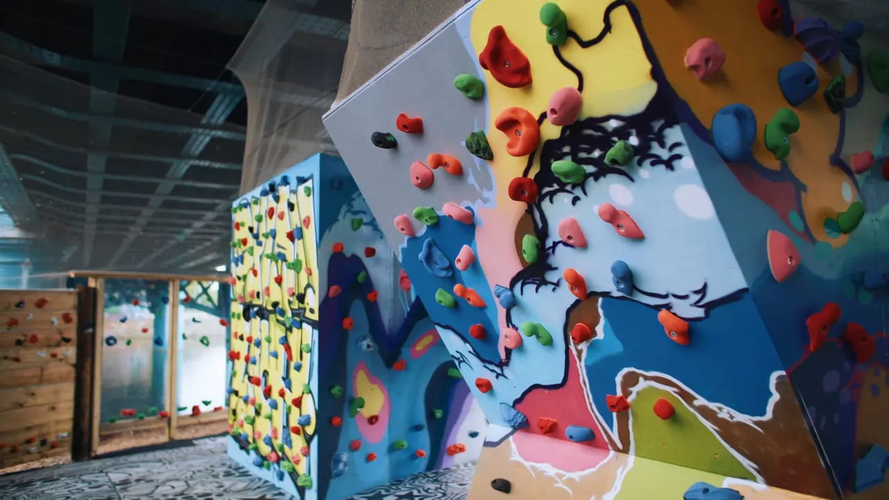 Colourful outdoor-style bouldering panels with holds at Boatyard Boulders.