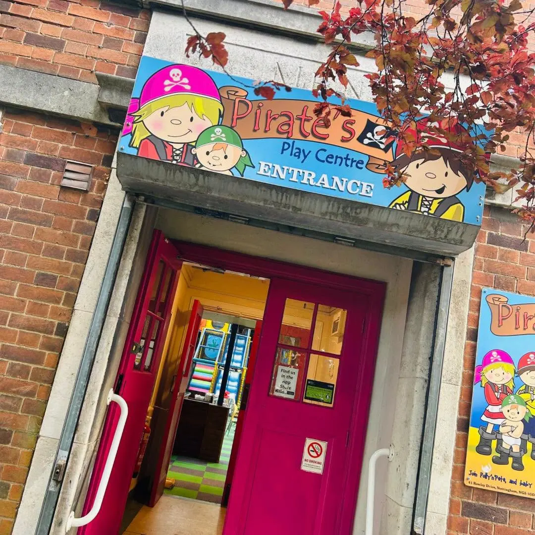Pink entrance doors of Pirate's Play Centre on Rowley Drive with soft play visible inside